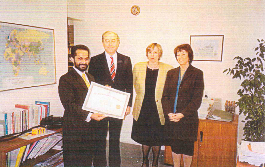 Receiving Post Graduate Diploma from the Director of the British Institute of Homeopathy, London