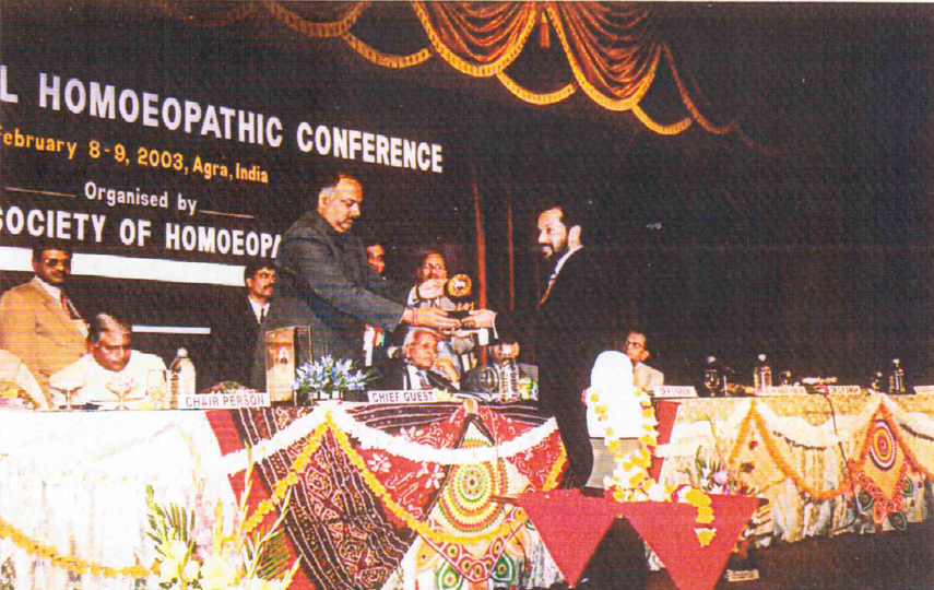Being felicitated by the Health Minister, Uttar Pradesh, India at the 12th International Homeopathic Conference